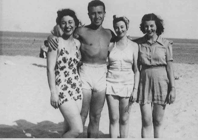 Osie, Cy, Sylvia, and Adele, on the beach in Long Branch, probably 1940