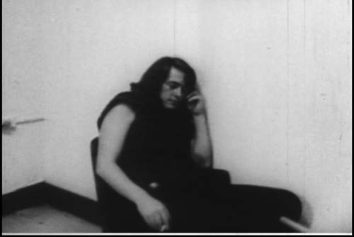Michael McClure as a crazed gang member, now a precinct prisoner